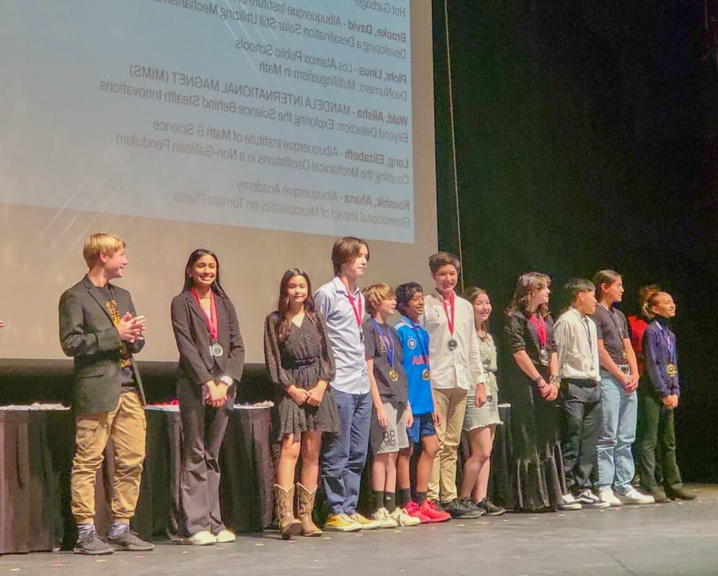 Students receive awards at science fair ceremony.